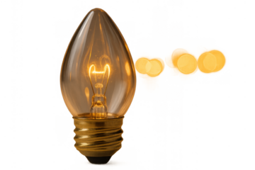 Warm illuminated filament light bulb generating inspiration and creative ideas with bokeh effect, isolated on transparent background