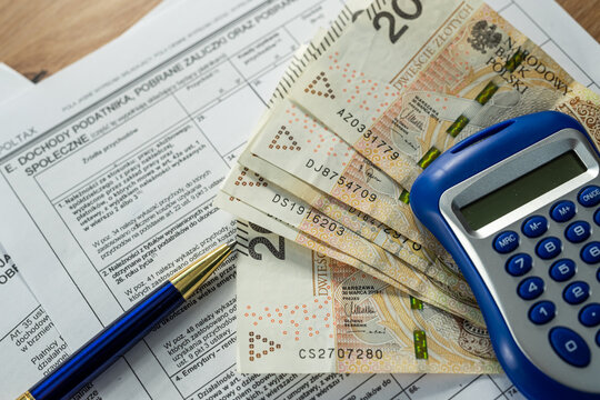 Polish PIT-11 tax declaration with 200 zloty and blue calculator, financial planning and report concept
