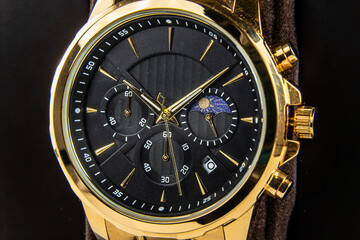 Premium black dial wristwatch with golden hands, numerals and metal bracelet, elegant men’s style