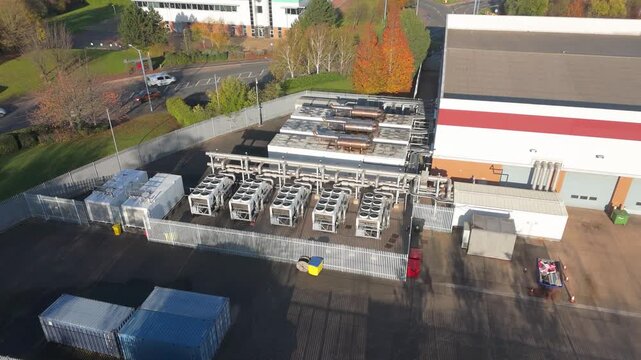 Drone orbiting shot of a data centre's cooling, diesel generators and power distribution system located in Wednesfield, UK