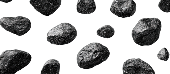 Scattered dark gray rocks against a black background (2)