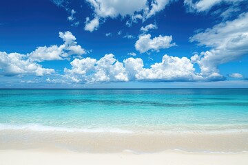 Fototapeta premium Bright tropical beach with turquoise sea and white sand under vivid blue sky and scattered clouds, perfect for travel advertising, resort promotions, and summer relaxation designs
