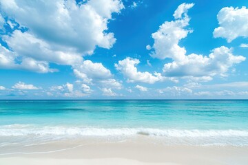 Obraz premium Tropical beach with soft white sand and gentle turquoise waves under blue sky filled with fluffy clouds, perfect for travel promotions, summer backgrounds, and resort advertisements