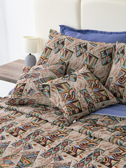 sofa cushions and bedspreads made of tapestry on a sofa or armchair, variegated fabric