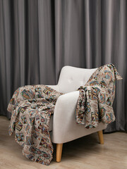 sofa cushions and bedspreads made of tapestry on a sofa or armchair, variegated fabric