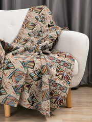 sofa cushions and bedspreads made of tapestry on a sofa or armchair, variegated fabric