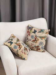 sofa cushions and bedspreads made of tapestry on a sofa or armchair, variegated fabric