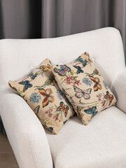 sofa cushions and bedspreads made of tapestry on a sofa or armchair, variegated fabric