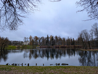 A lake in the park in late autumn on a cloudy day