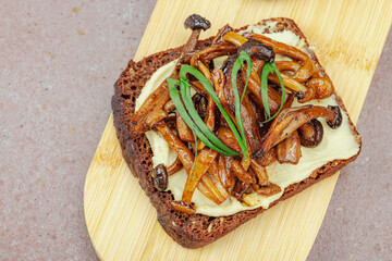 Healthy plant-based open sandwiches with sautéed Shimeji mushrooms. Protein rich vegan meal