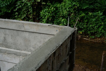 Reinforcement Steel Rebar Cage and Concrete Wall Foundation during Construction. Structural Engineering Detail.