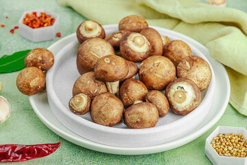 Fresh raw cremini mushrooms with spices and herbs. Healthy ingredient for cooking vegan food