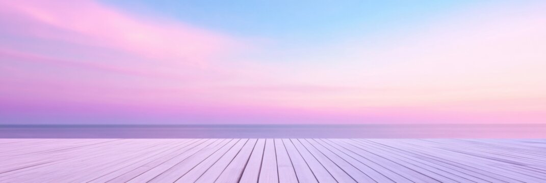Serene sunrise over calm ocean with pastel sky