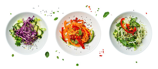 Three oval plates of colorful salads isolated on transparent background