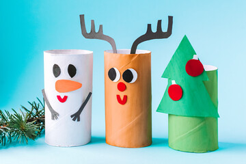 Christmas toy from toilet tube roll, paper toy santa claus, snowman, reindeer, tree rabbit on...
