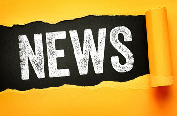 NEWS text displayed on torn paper with bold distressed typography. Concept for current events,...