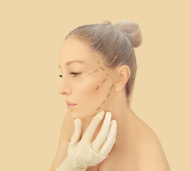 Marking the face.Perforation lines on females face, plastic surgery concept.
