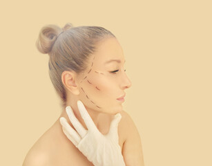 Marking the face.Perforation lines on females face, plastic surgery concept.