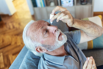 Eye drops, senior man with medical, healthcare and wellness pharmaceuticals. Senior male with dry...