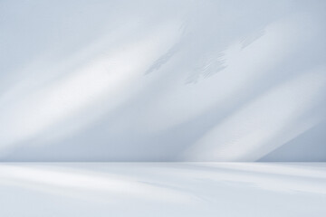 Obraz premium Blue light shadow overlay Background, Empty wall room studio with leaves shadow Interior design floor Stage product presentation display Cosmetic layout, Minimal Mockup design, Winter colour backdrop