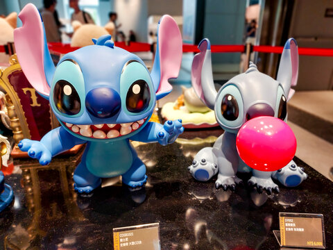 Taipei City, Taiwan &ndash; March 24, 2024: Disney Lilo & Stitch Character Stitch Blowing a Red Bubblegum Bubble Displayed at Syntrend Creative Park