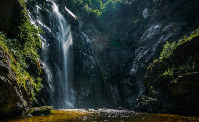 A Toxa waterfall under sublime lighting on a summer evening