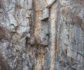 Close up view of the cracks and fissures in the granite cliffs of Punta Moras