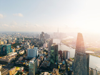 Ho Chi Minh City skyline and skyscrapers on Saigon river Aerial view with sunlight. Financial...