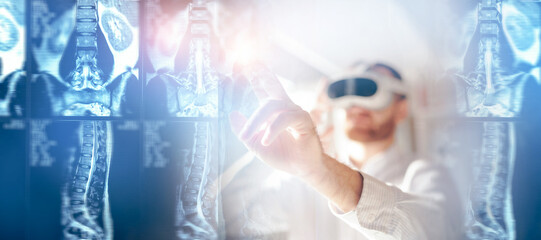 Male doctor using VR headset technology to analyze spinal x-rays. Medical use of glasses for data analysis MRI scan, banner