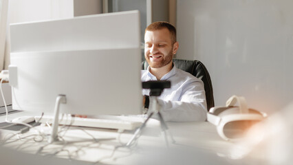 Workplace with immersive technology VR headset, happy programmer use webcam for video call and presentation new virtual reality glasses