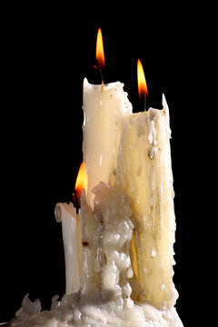 burning candles on a dark background