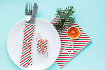 Christmas table setting for christmas dinner, served table with plate, gift, champagne glass, New...