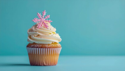 Beautiful vanilla cupcake decorated with white frosting and delicate sugar snowflake on pastel blue background, bright minimal winter dessert concept symbolizing sweetness, purity celebration