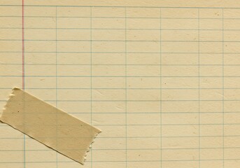 Textured vintage ledger paper with grid lines and an old torn adhesive tape diagonal element