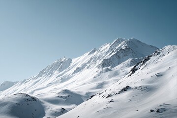 Obraz premium Snow-covered Mountains Under Clear Blue Sky in Winter Landscape
