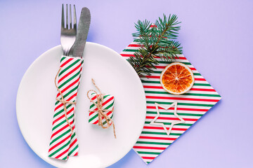 Christmas table setting for christmas dinner, served table with plate, gift, champagne glass, New...