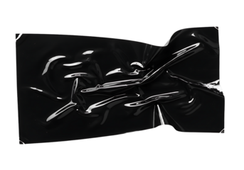 Dynamic crumpled black plastic surface with striking reflective highlights creating an intriguing abstract texture on a dark canvas