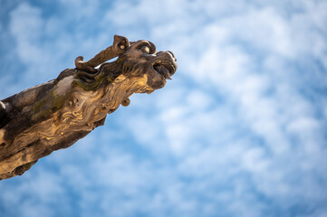 Prague, Czech Republic, August 8, 2023. Close-up view of a gargoyle on St. Vitus Cathedral. Beautiful summer day. Travel destinations.