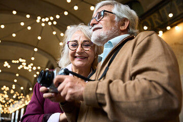 Senior couple traveling sightseeing and taking pictures