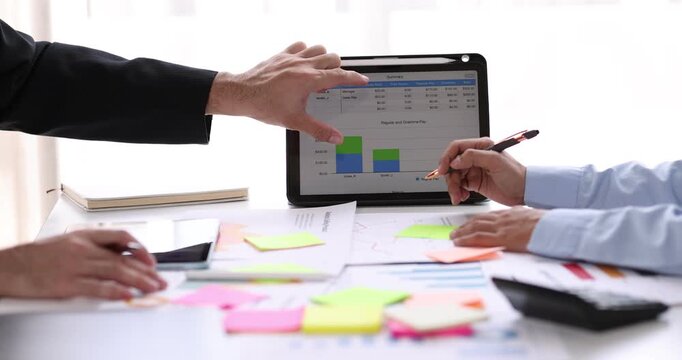 Business man investment consultant analyzing company annual financial report balance sheet statement working with documents graphs. Concept picture of business, market, office, tax.
