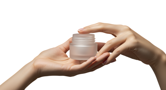 Elegant female hands carefully presenting a minimalist frosted glass jar designed for premium beauty or skincare products ontransparant background