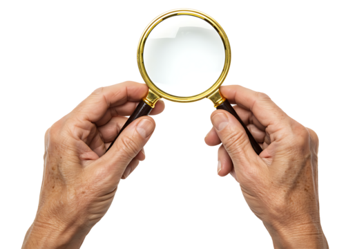 A pair of human hands holding a classic golden-framed magnifying glass against a dark backdrop for detailed examination