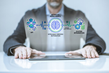 Intelligent Business Solutions: A Professional Engages with a Diagram on Artificial Intelligence and Automation