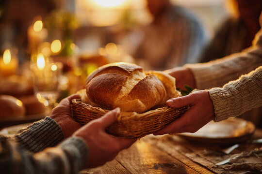 Warm Thanksgiving moment as fresh bread is passed around the table. Soft candlelight, shared food and gratitude create a heartfelt holiday gathering full of comfort and connection.