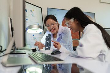 Researchers are working with a 3D printer to print clear, white plastic models using cutting-edge, focused technology in the lab.	