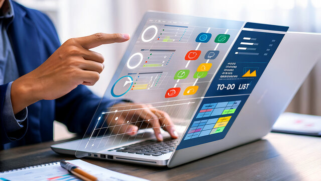 Businessman using futuristic interface to analyze financial data with laptop, chart, and todo list for strategic planning