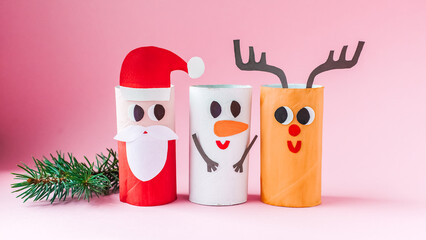Christmas toy from toilet tube roll, paper toy santa claus, snowman, reindeer, tree rabbit on...