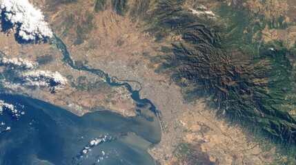 satellite view river estuary mountains coast
-