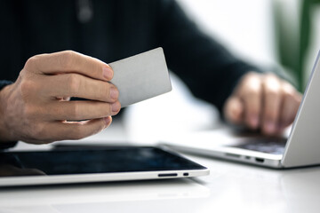 Man using credit card and paying via mobile banking app. Internet payment, online shopping, concept.