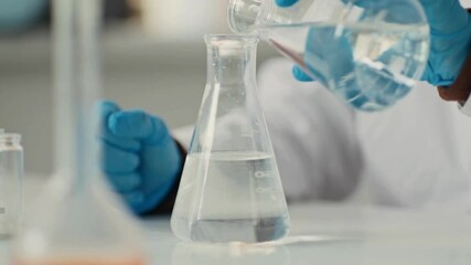 Close-up 4K Ultra HD footage of liquid mixing in a flask demonstrating a precipitation reaction in a laboratory, showing chemical formation, fluid motion, and scientific experiment process. - Powered by Adobe